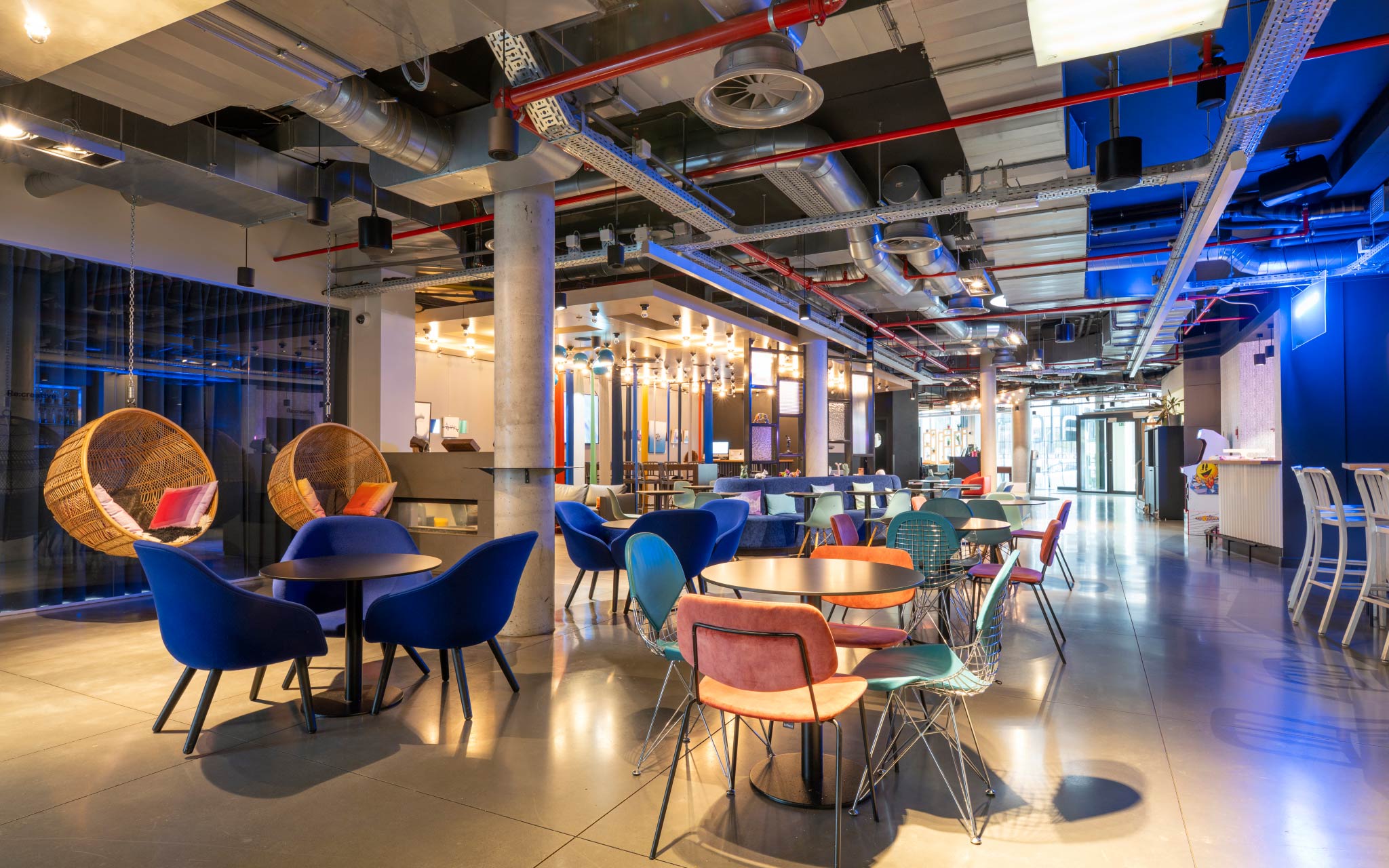 Tables and chairs from the bar and entrance of Pestana Brussels Schuman, a hotel in Brussels, Belgium