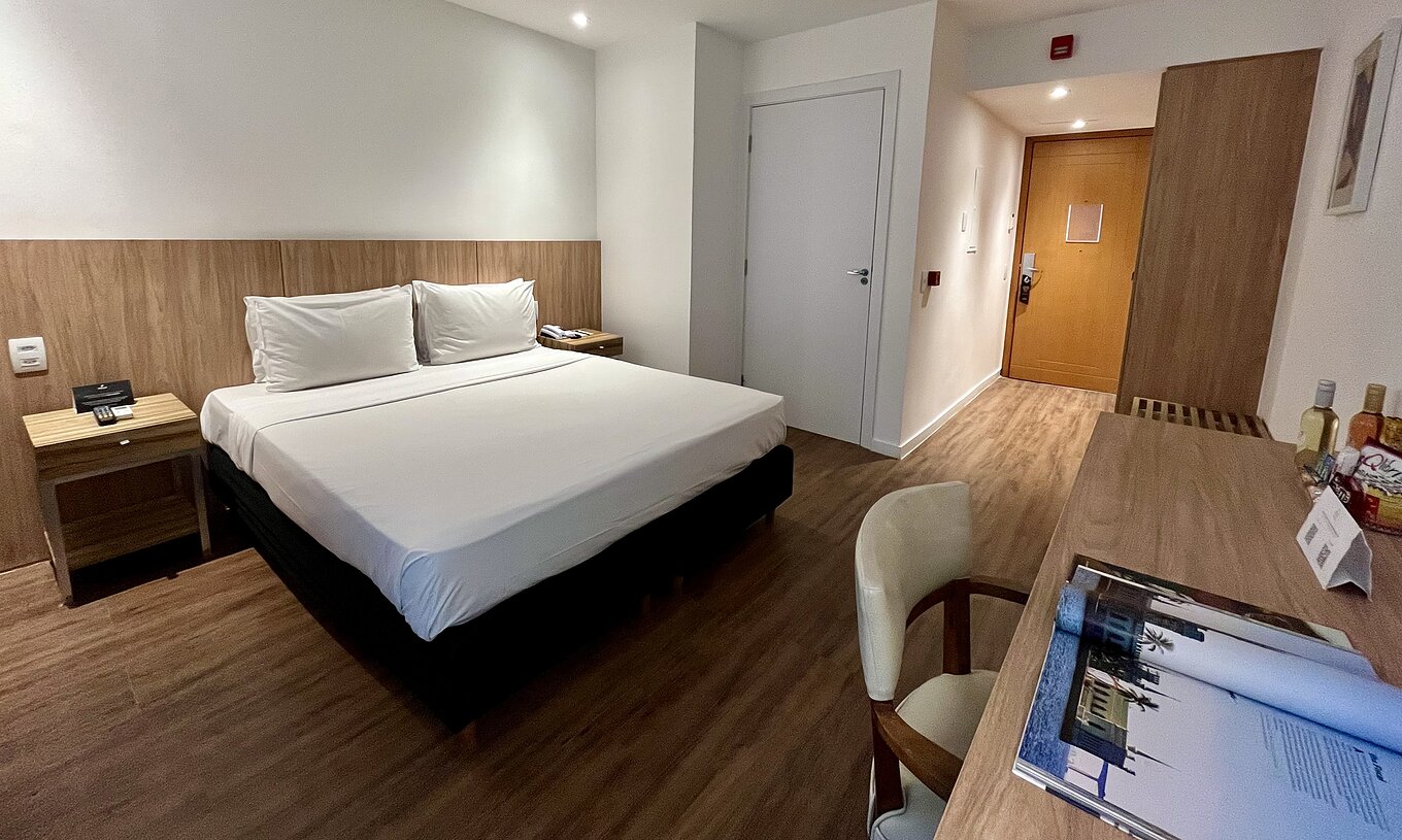 The Semi-Adapted Room at Pestana Rio Atlântica has a double bed, desk and chair