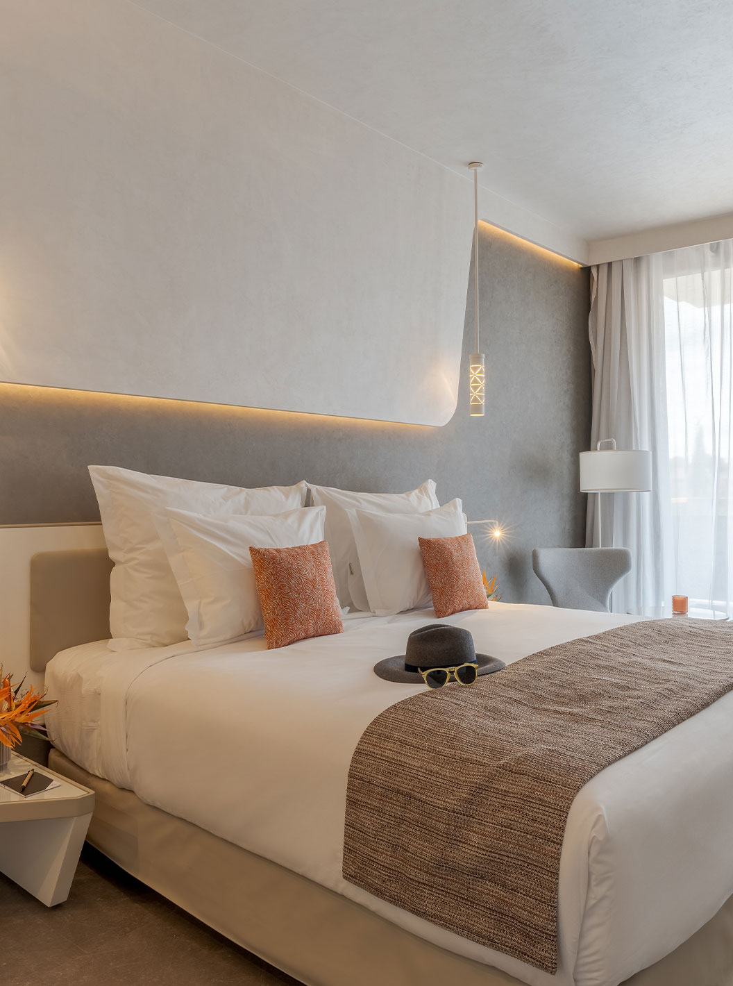 CR7 Superior at Pestana CR7 Marrakech featuring a bright bedroom with king bed, chairs and sheer curtains