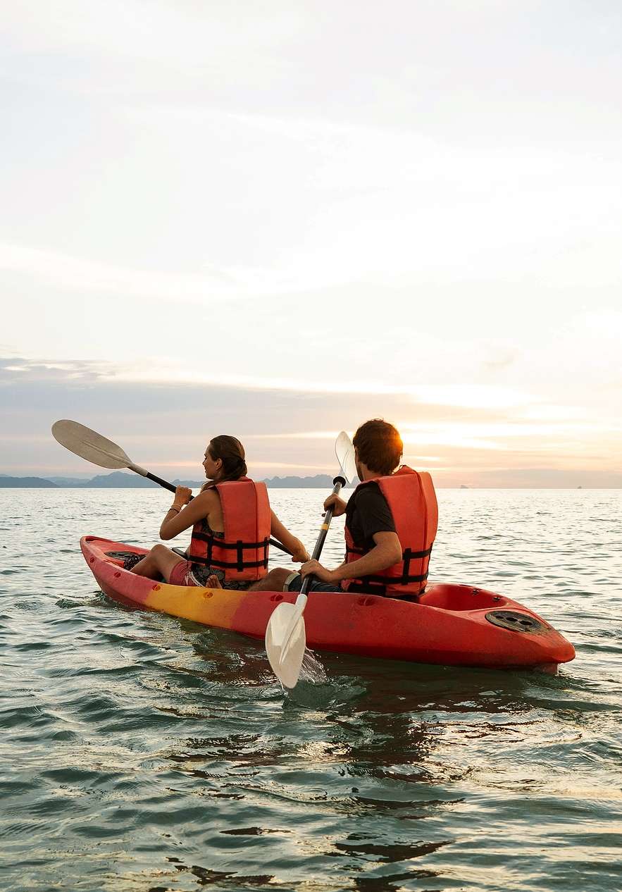 Kayaking at sunset near Pestana Tróia, Eco Resort a 10 Minutos da Praia da Comporta on calm coastal waters