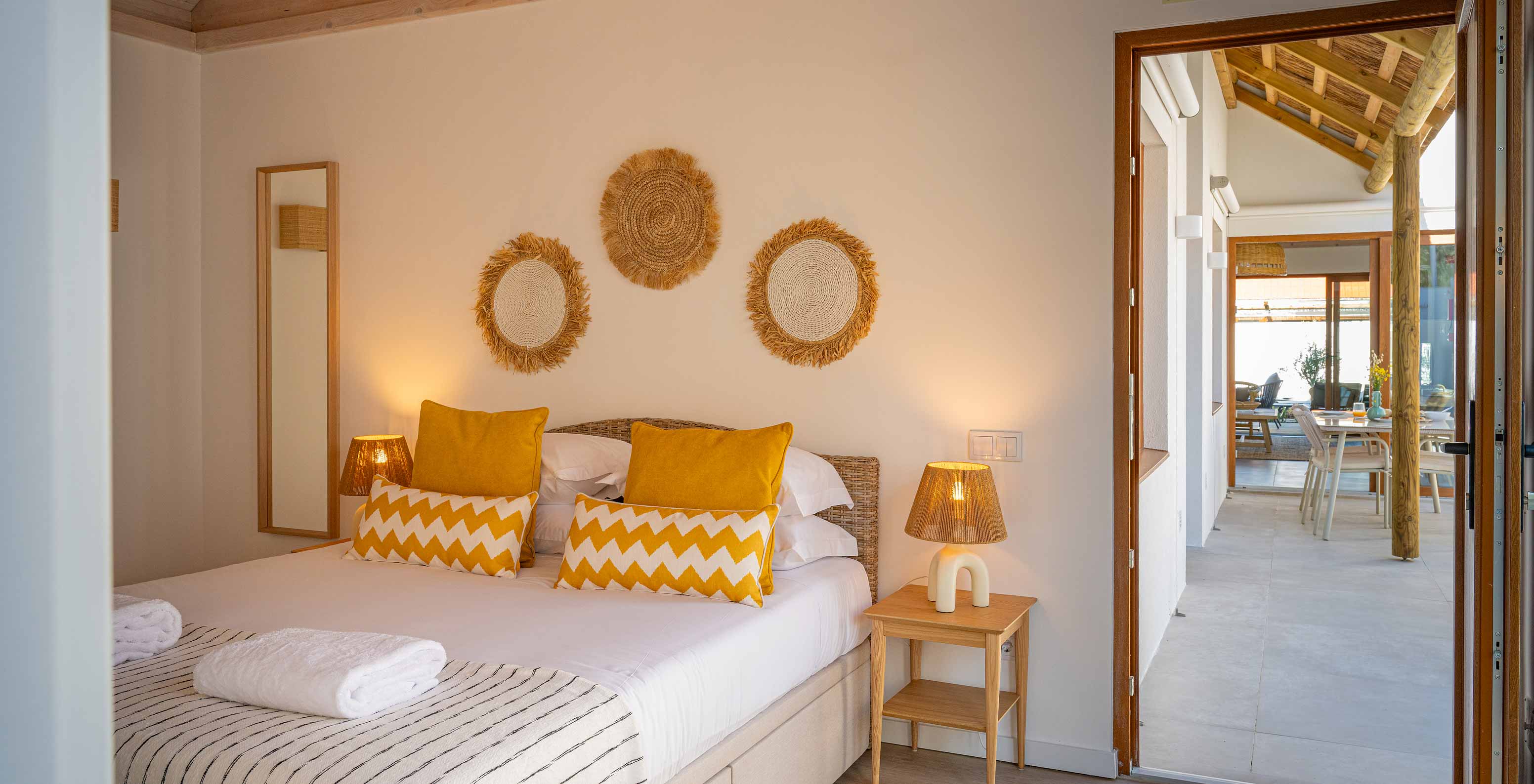 The Superior Green Villa at Pestana Comporta Village Residences has a bedroom with a double bed and yellow pillows