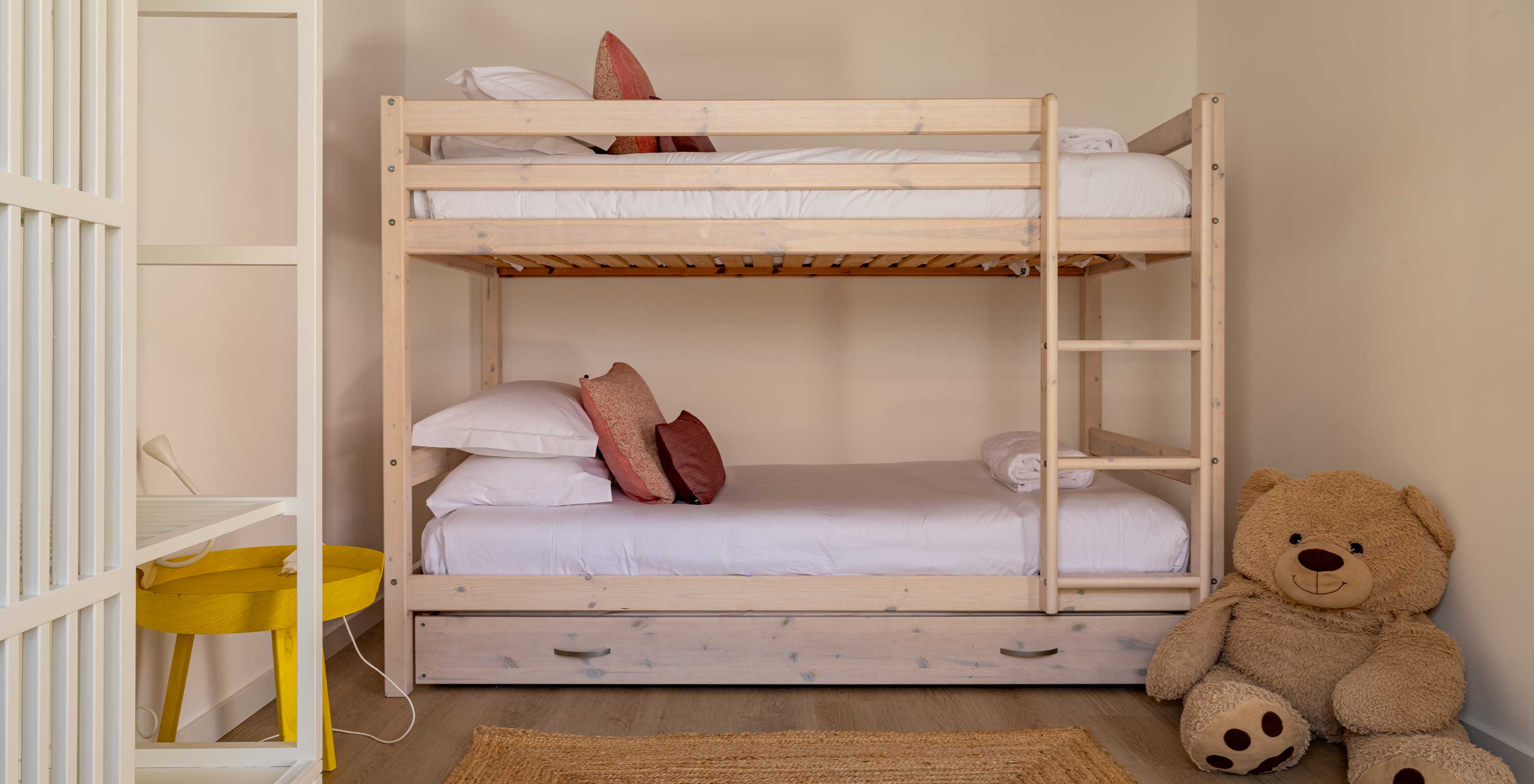 The Standard Green Villa at Pestana Comporta Village Residences has a wooden bunk bed with two beds and a teddy bear
