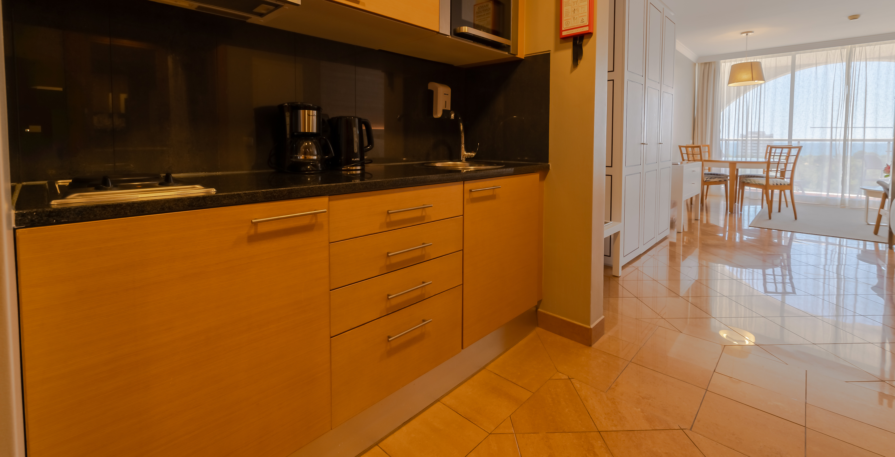 The T0 - Premium Studio at Pestana Alvor Park has a kitchen with a kettle, microwave, and stove