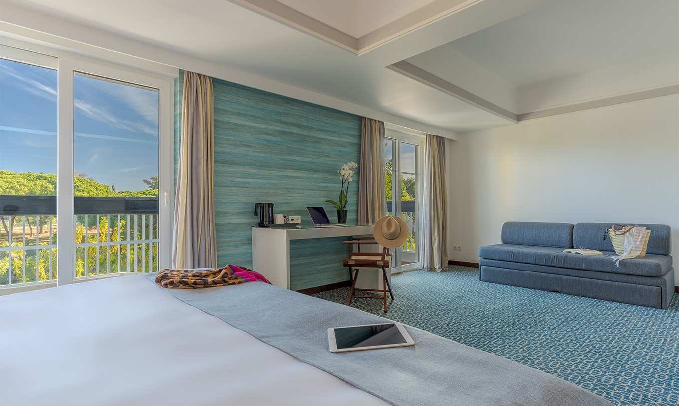 The Superior at Pestana Alvor Praia has a double bed, a sofa bed, and a large window desk with garden views