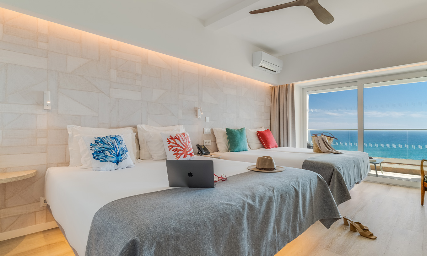 The Superior Family Sea View Room at Pestana Blue Alvor Beach has two double beds, air conditioning, and a balcony with view