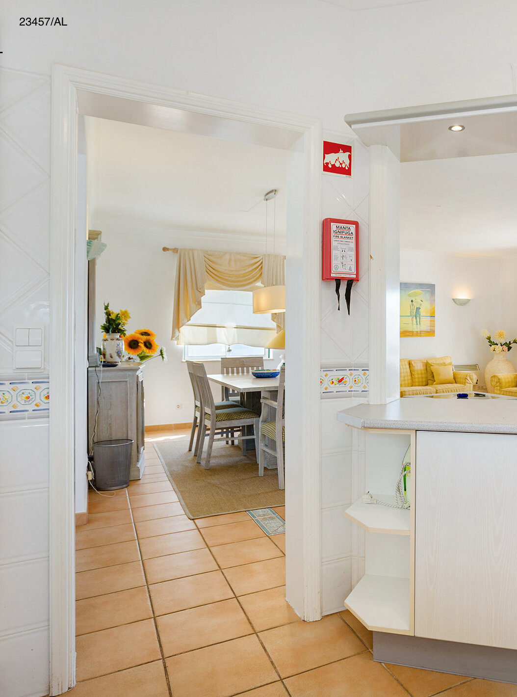 The Pestana Carvoeiro Golf T3 Standard Apartment has a kitchen with white cabinets and countertop open to the living room
