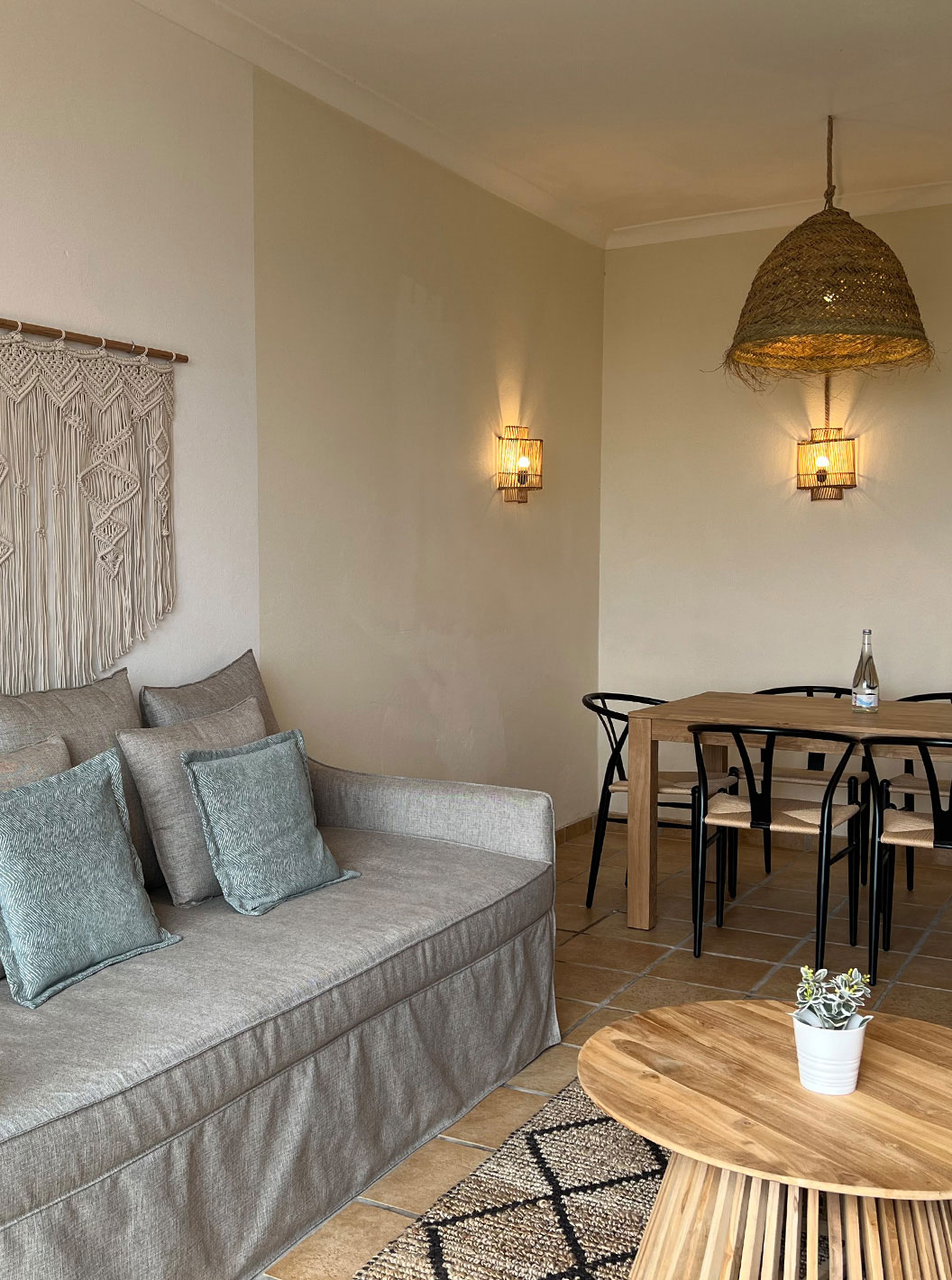 Premium Two-Bedroom Apartment at Pestana Palm Gardens featuring sofa seating and a wooden dining table