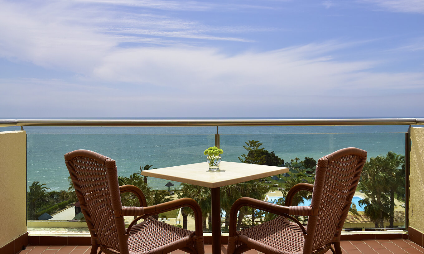 The Deluxe Superior Sea View room at Pestana Viking features a balcony with a table and two chairs, and sea view