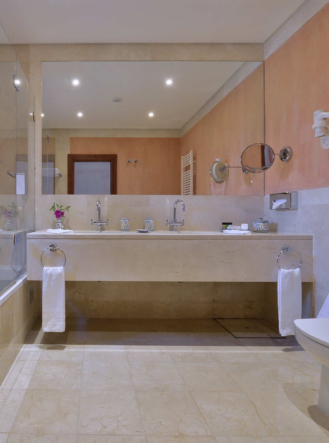 The Suite Garden View Vila Sol at Pestana Vila Sol - Vilamoura has a bathroom with two sinks and bathtub with shower