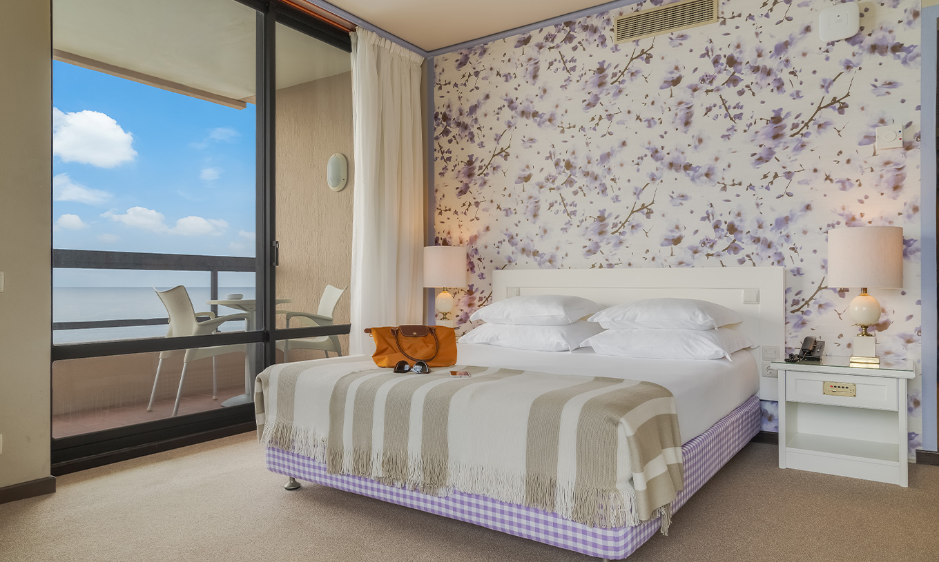 Standard Sea View room at Pestana Bahia Praia has a double bed, with 4 pillows and a balcony with sea view