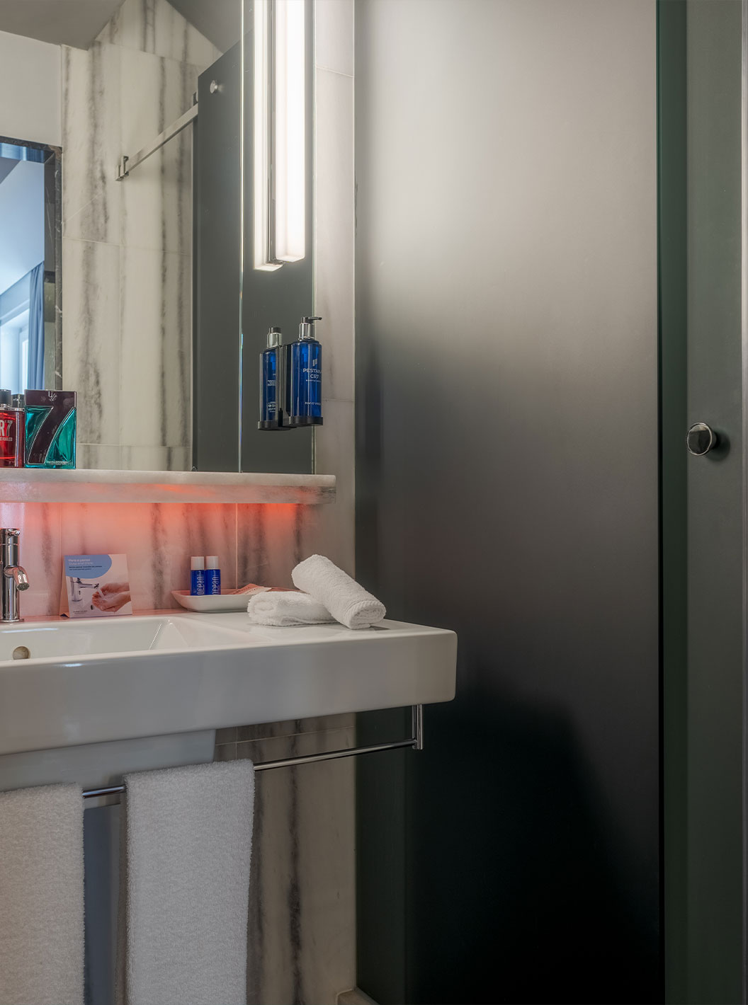 The CR7 Superior Rooftop Room at Pestana CR7 Lisboa has a bathroom with mirror, sink, and shower