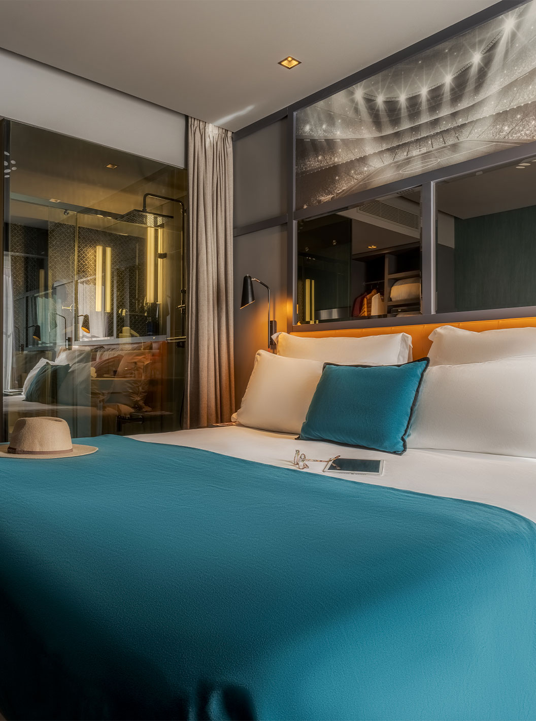 The CR7 Superior Room at Pestana CR7 Lisboa features a double bed and mirror above the bed