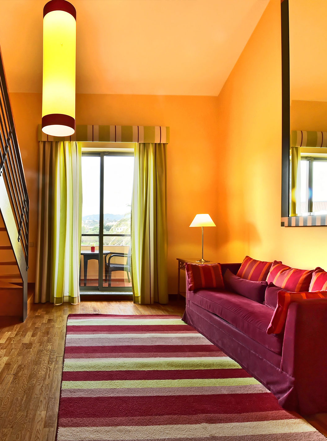 Superior Suite at Pestana Sintra Golf featuring a duplex lounge with staircase, sofa and balcony view