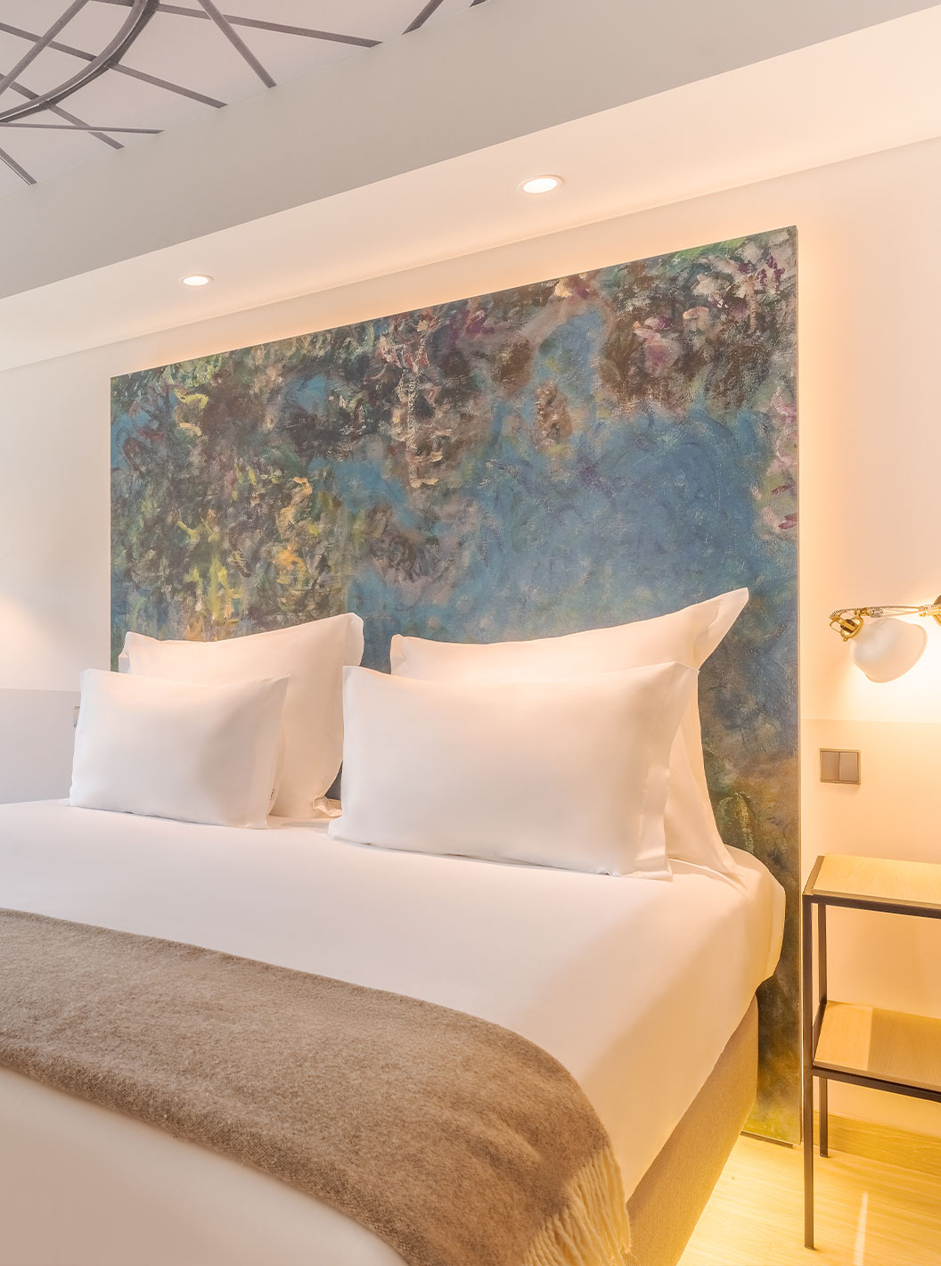 Superior Room at Pestana Douro Riverside featuring a large bed, abstract headboard art and balcony view