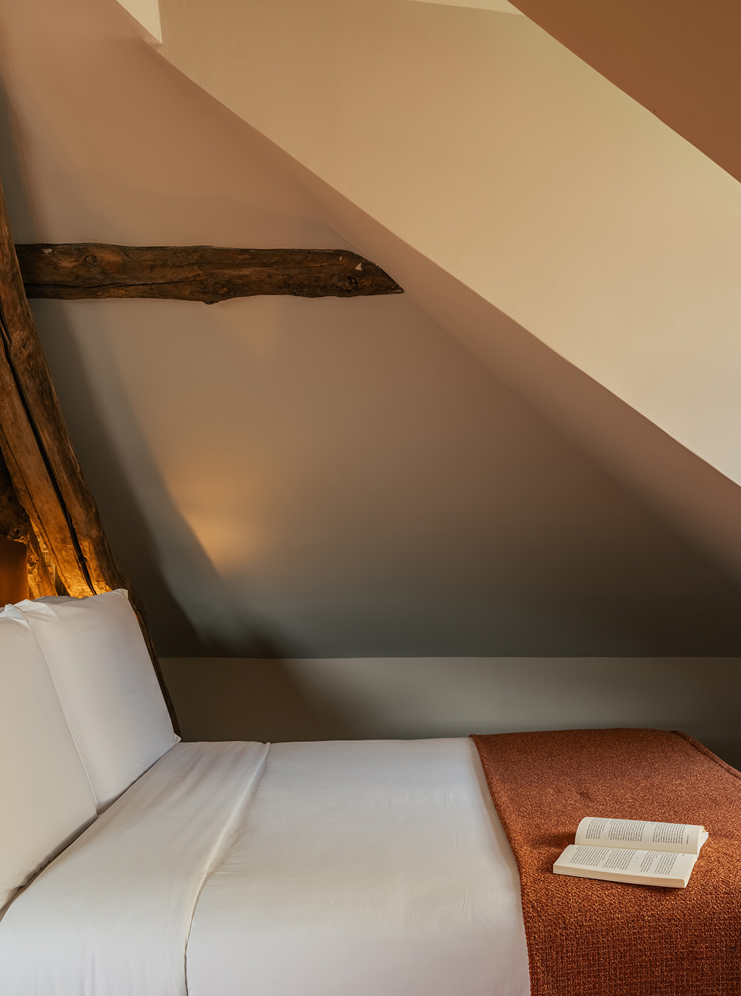 Heritage Family Suite at Pestana Vintage Porto with double bed, wooden beams and open book by the window