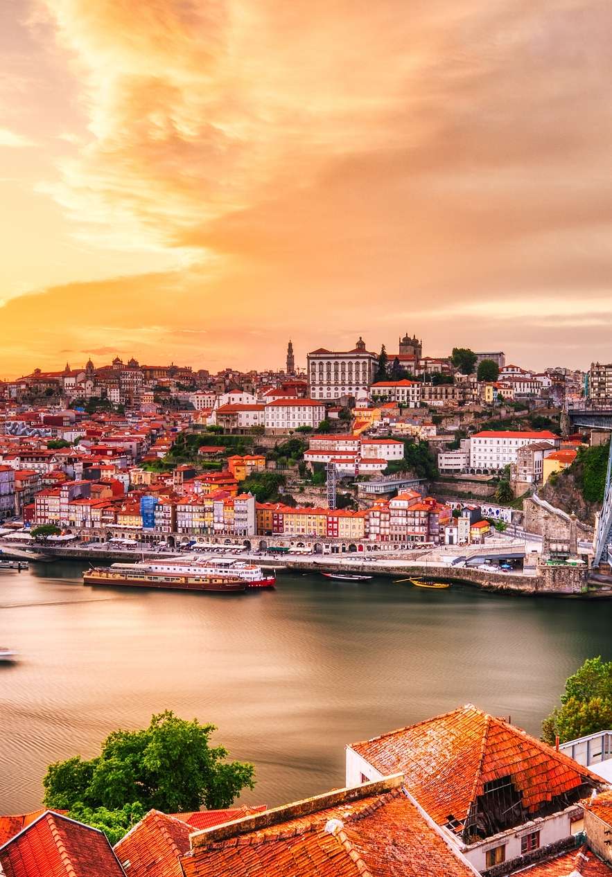 Sunset over the Douro River near Pousada Porto Rua das Flores, Hotel no Centro Histórico do Porto and hillside skyline