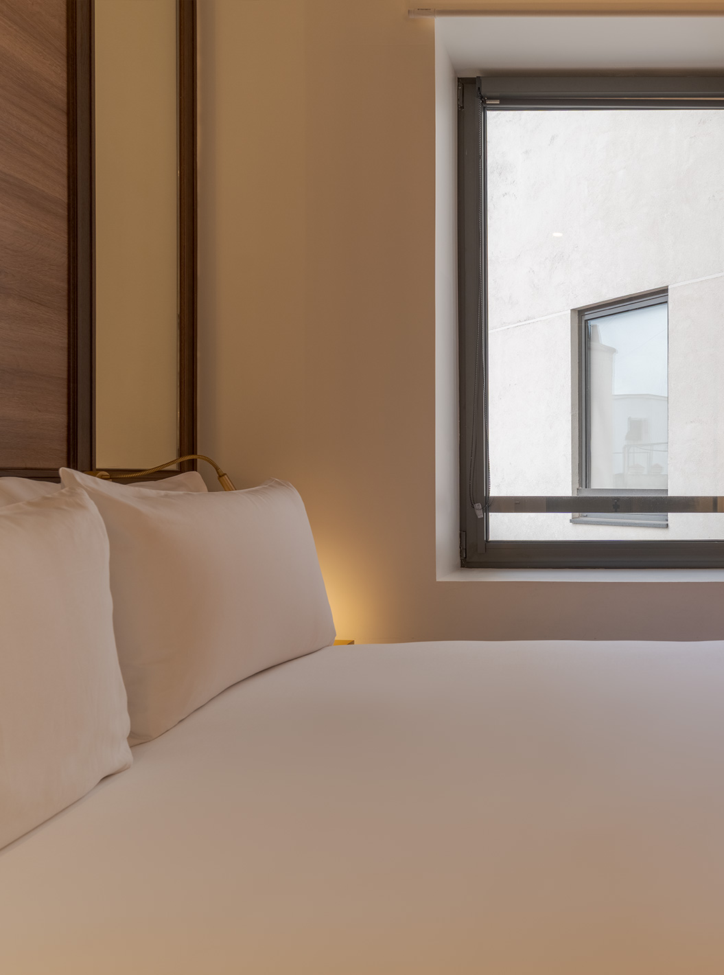 Small Double Room - Website Exclusive at Pestana CR7 Gran Vía Madrid with neatly made bed beside a window