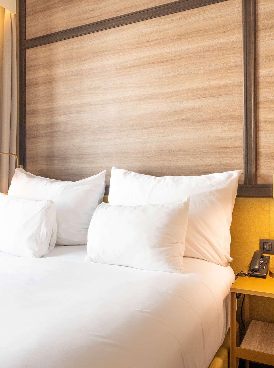 The Legend Room at Pestana CR7 Gran Vía Madrid has a double bed, bedside table, and two golden lamps