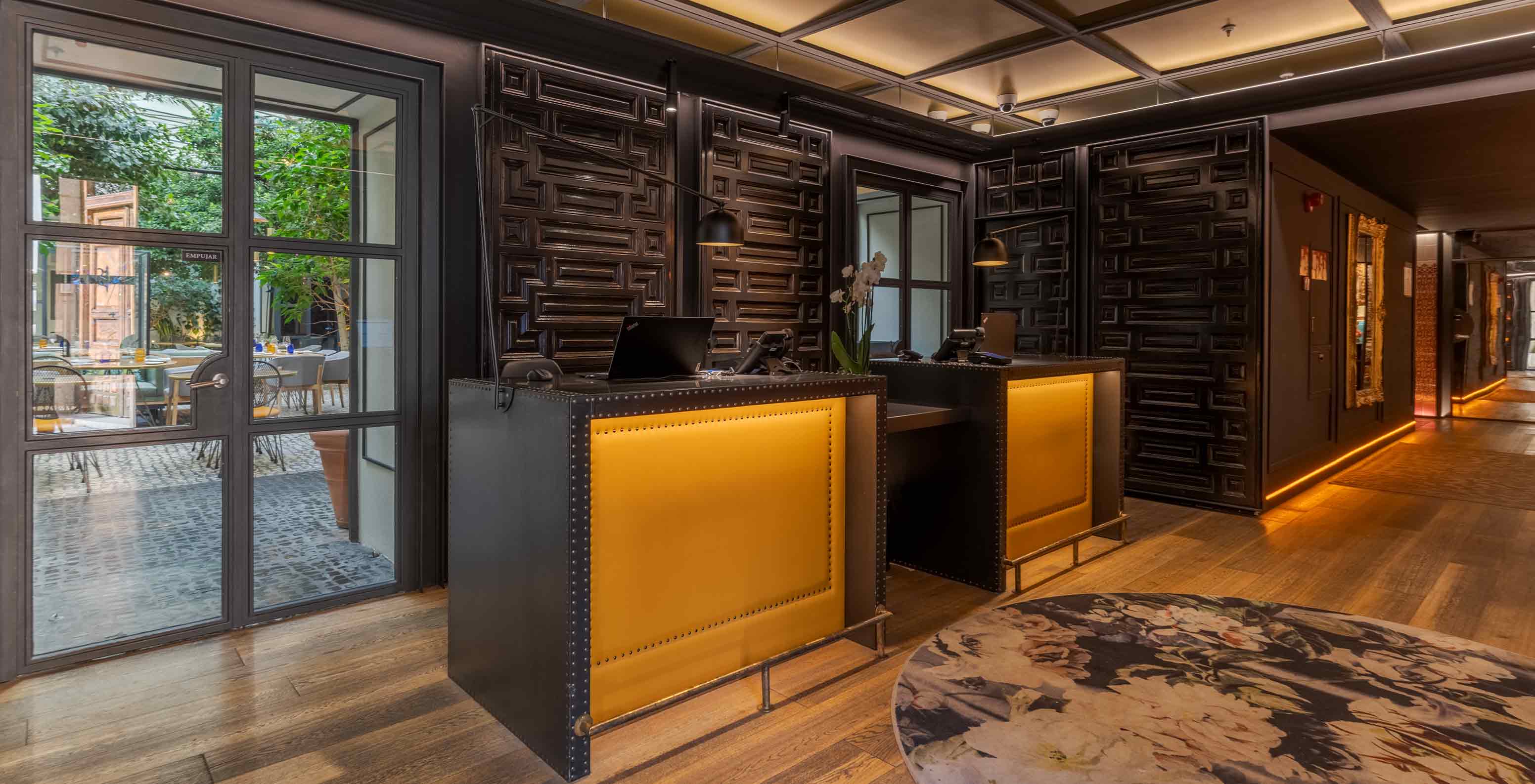 Pestana Collection Plaza Mayor, Hotel in the Historic Center of Madrid featuring a dark wood reception desk