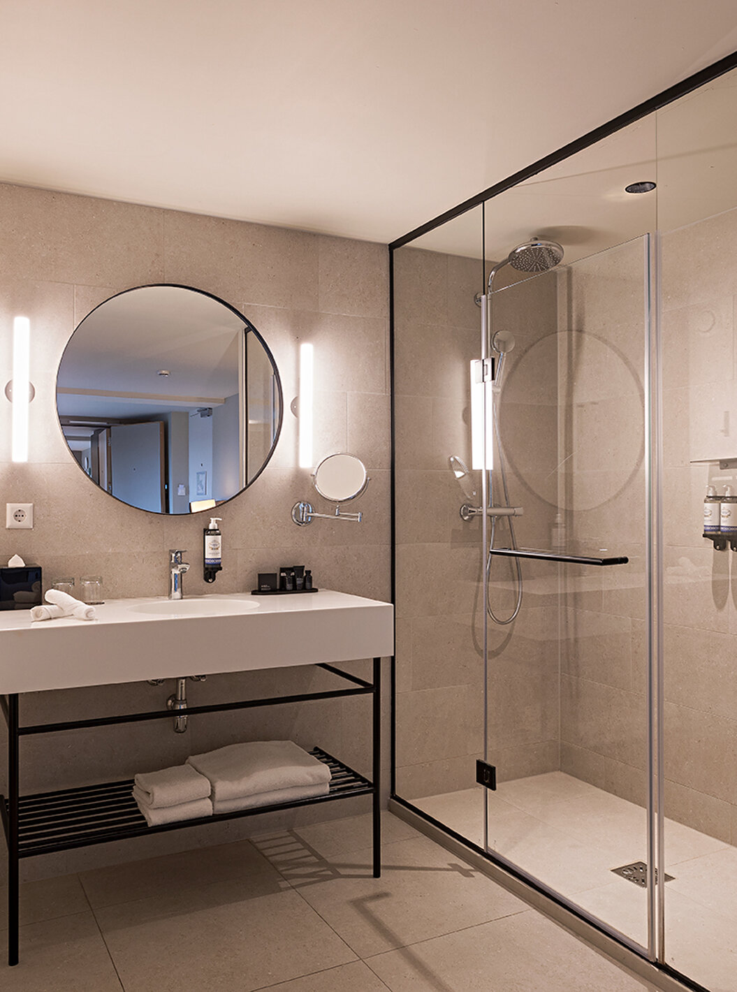 Executive Terrace room at Pestana Amsterdam Riverside has a bathroom with mirror, sink, towels and shower