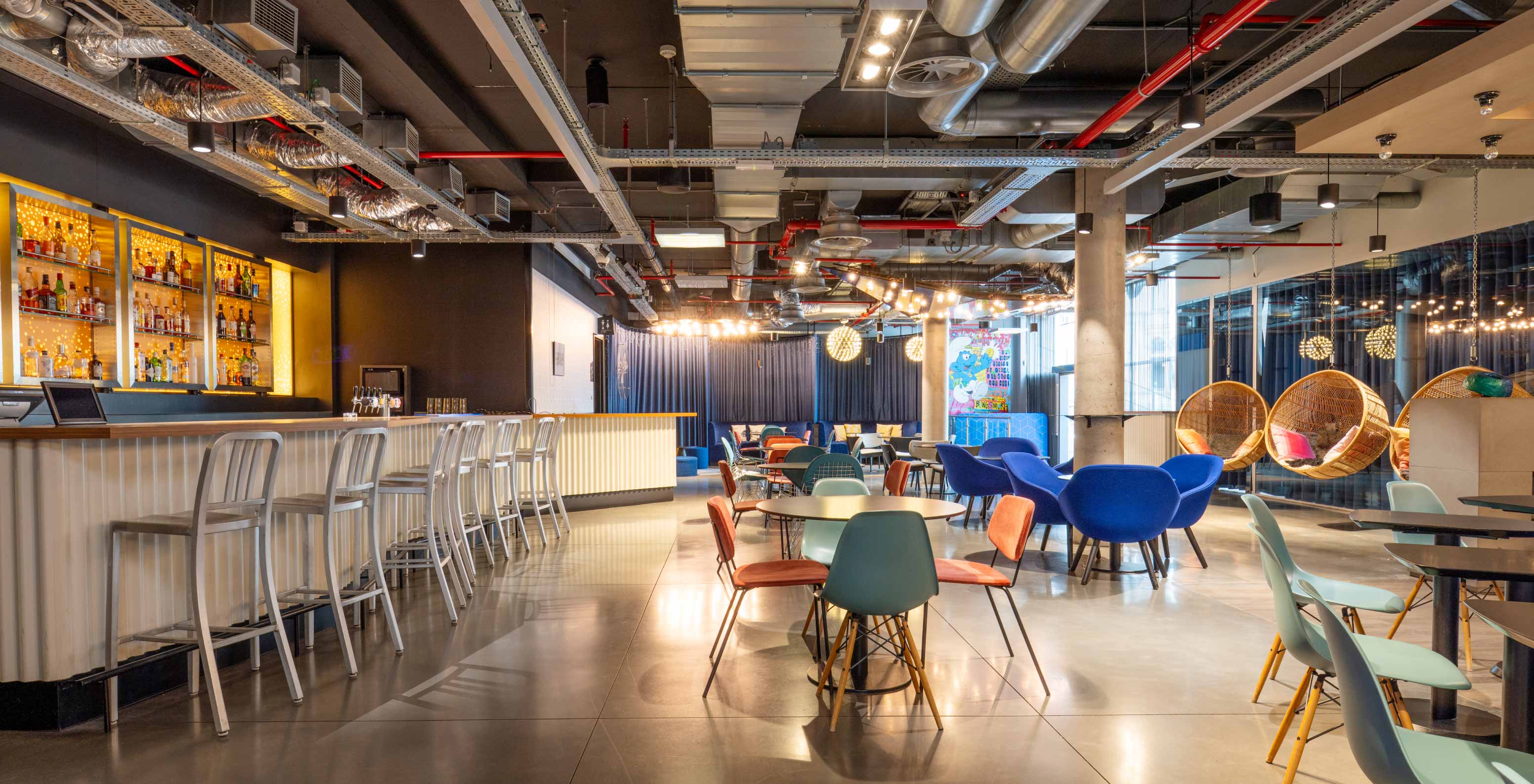 The hotel bar in Brussels near the European Parliament has high stools and round tables with chairs