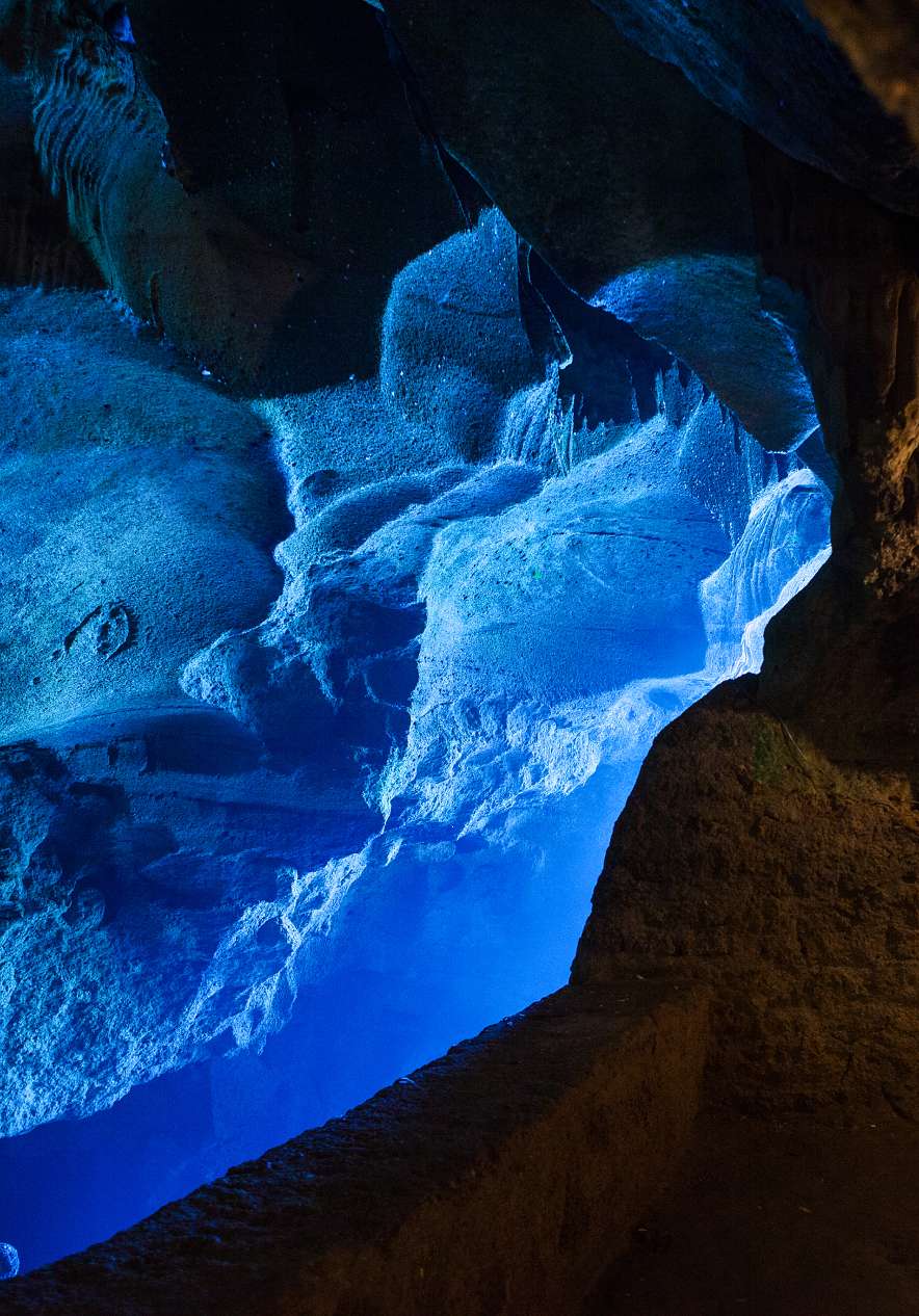 Exploring Hercules Cave near Pestana Tanger City Center, Hotel em Tânger Perto da Praia with blue rock walls
