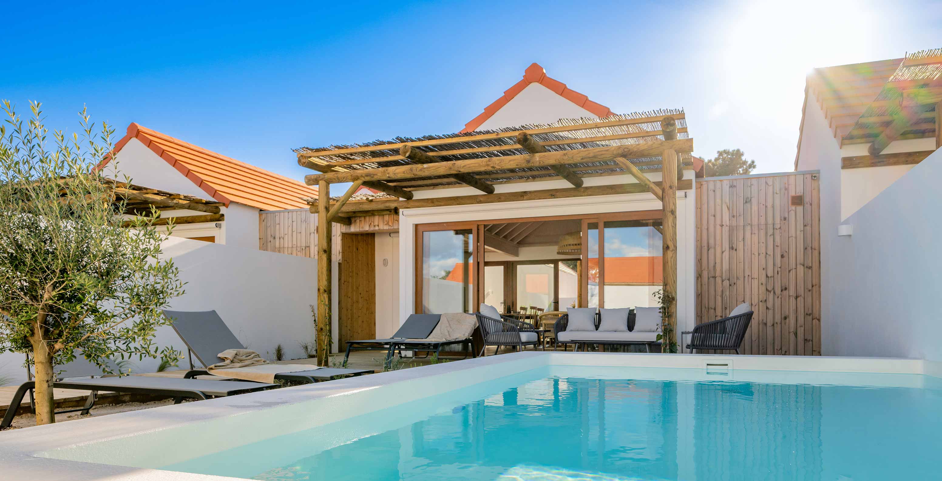 The Superior Green Villa at Pestana Comporta Village Residences has an exterior with a pool and several sun loungers