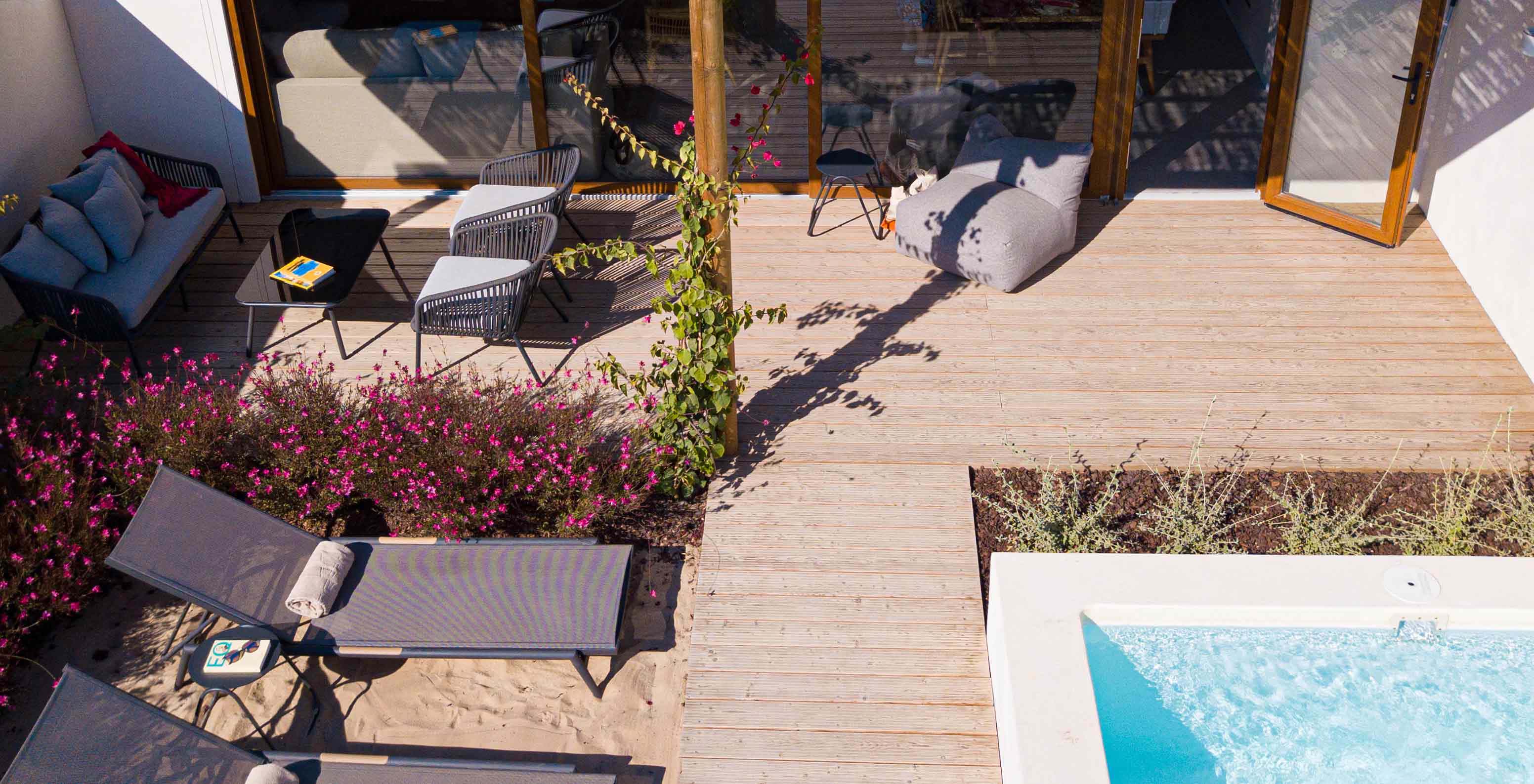 The Standard Villa T1 at Pestana Comporta Village Residences has a terrace with a pool, sun loungers, and plants