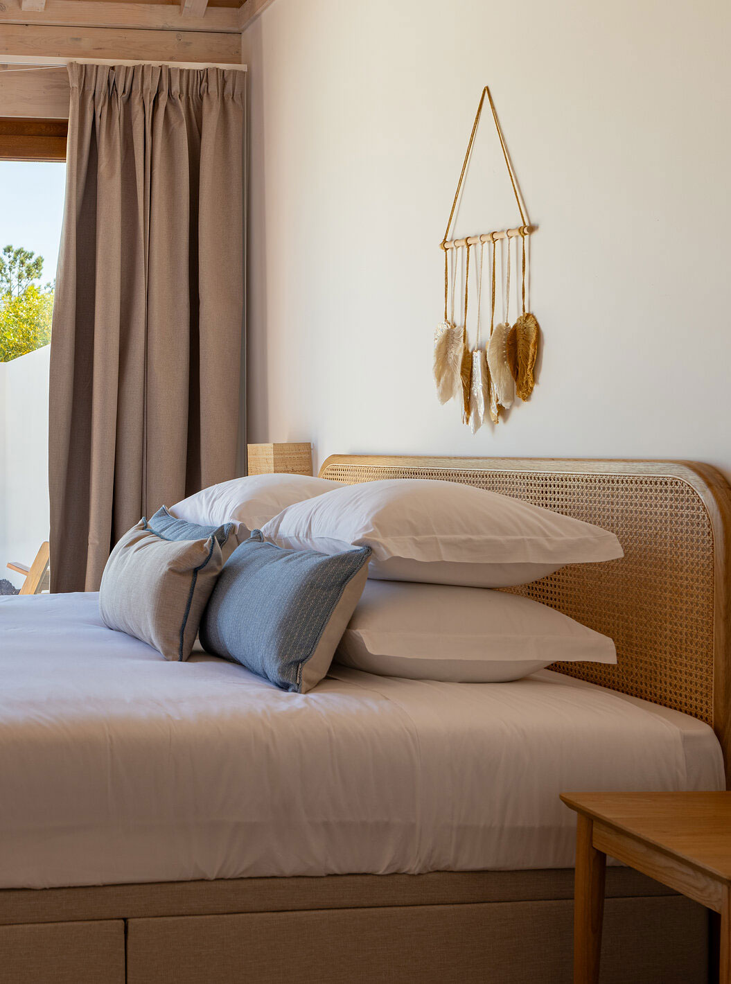 The Premium Green Villa at Pestana Comporta Village Residences has a bedroom with a double bed and a large window