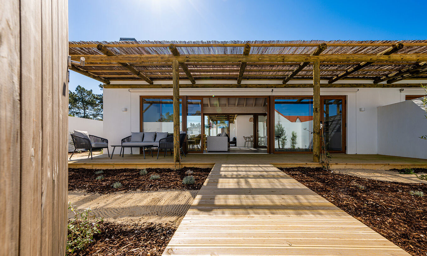 The Premium Villa at Pestana Comporta Village Residences has an entrance with a wooden deck, a pergola, and a garden