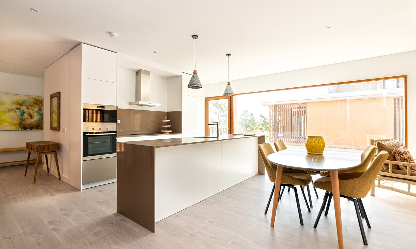 The Eco Village Apartment 1st Floor Views of Pestana Tróia Eco Resort has a kitchen with countertop and a table with chairs