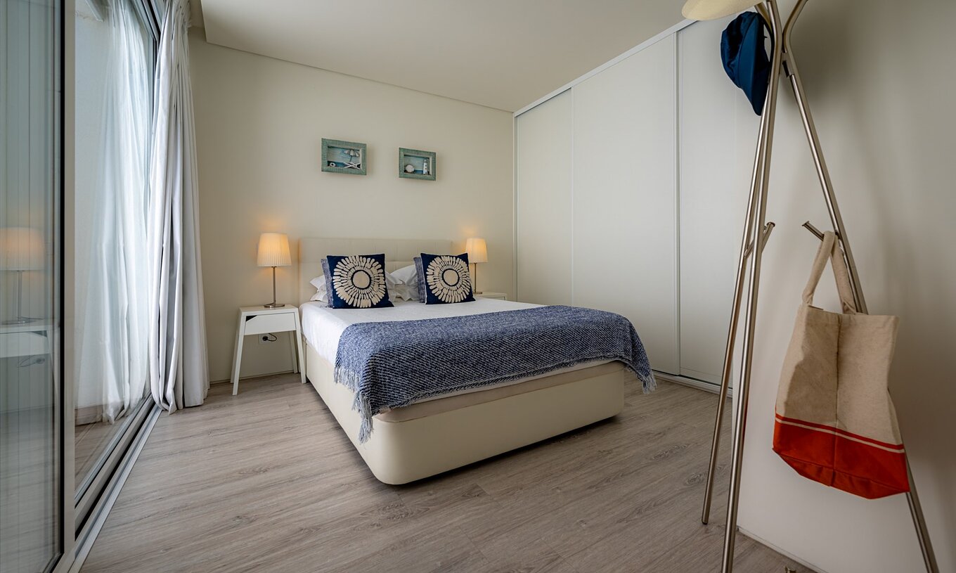The Green Villa with Private Pool of Pestana Tróia Eco Resort has a double bed with two bedside tables and a bedspread