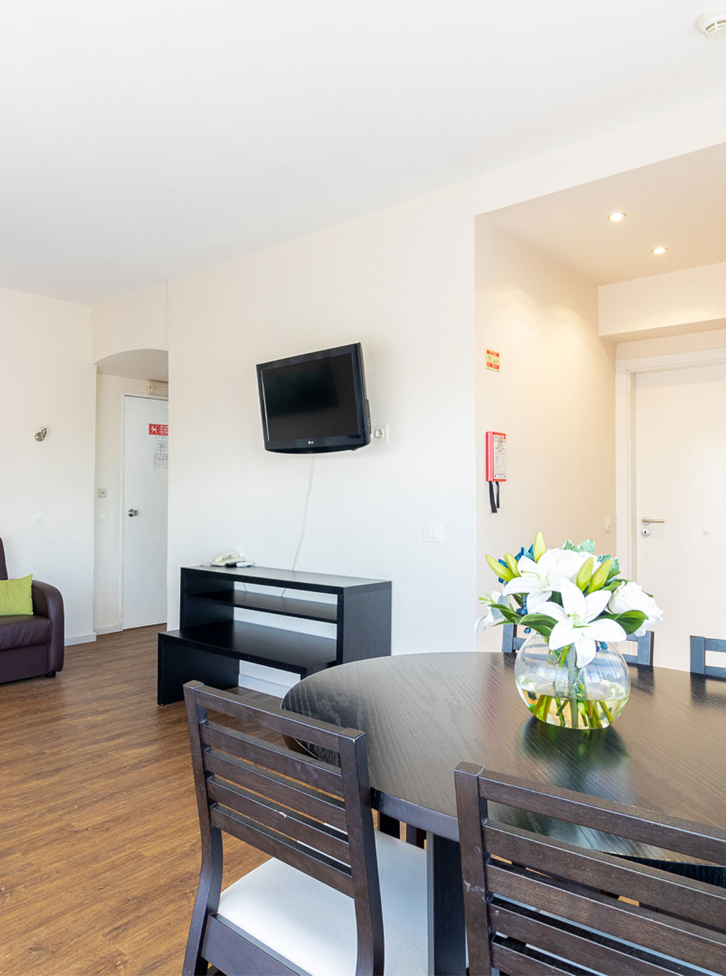 In the T1 Garden View Apartment at Pestana Alvor Atlântico, you can enjoy the living room with table, sofa, and TV