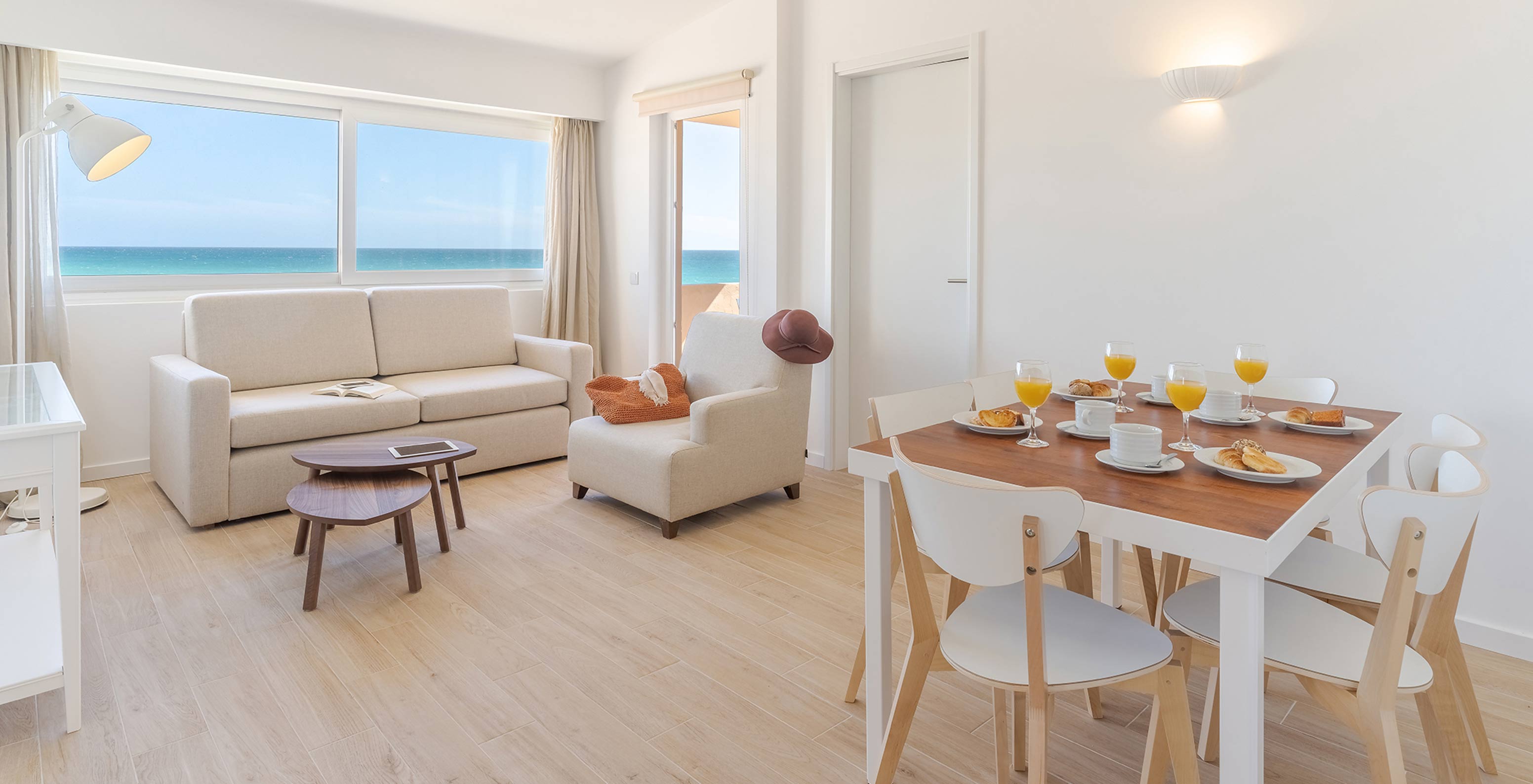 The Premium 2-Bedroom Garden View Villa at Pestana Alvor Beach Villas has a dining table and a living room