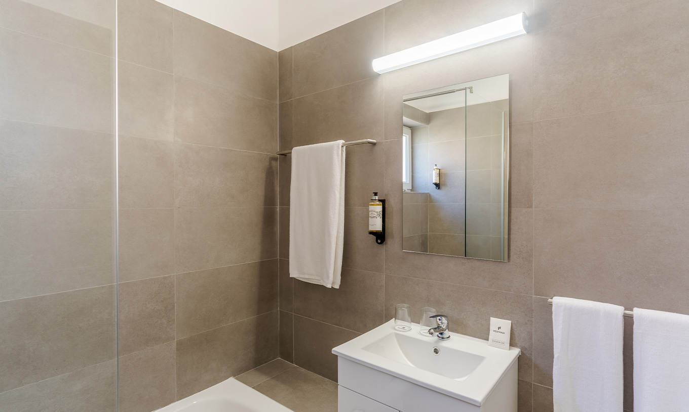 The 3 Bedroom Garden View Villa at Pestana Alvor Beach Villas has a bathroom with a sink and towel