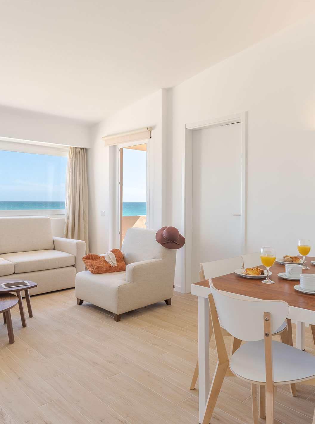 The 3 Bedroom Premium Sea View Villa at Pestana Alvor Beach Villas has a living room with sofas and a tabl