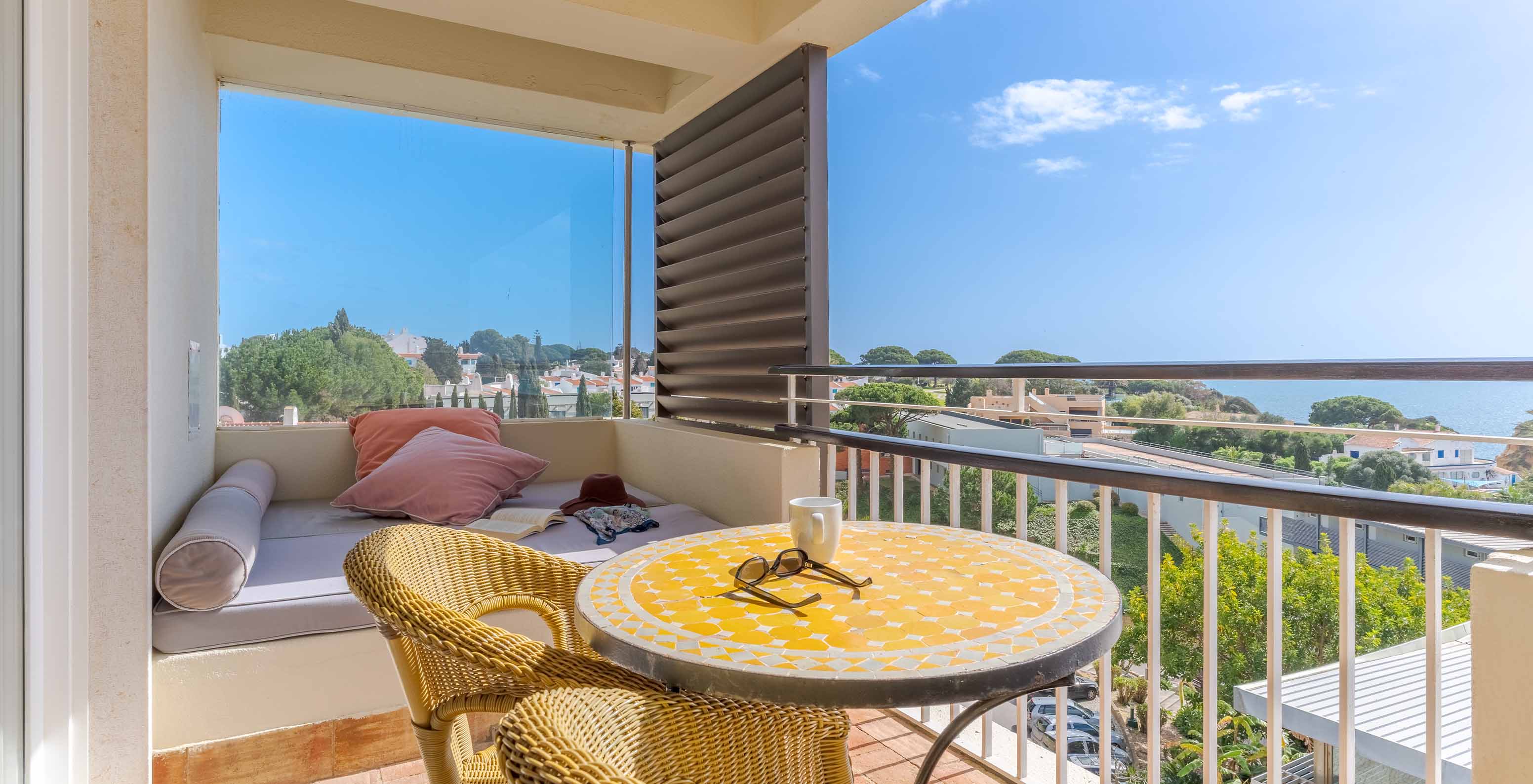 The Sea View Suite at Pestana Alvor Praia has a balcony with a table, chairs, and a sofa with sea views