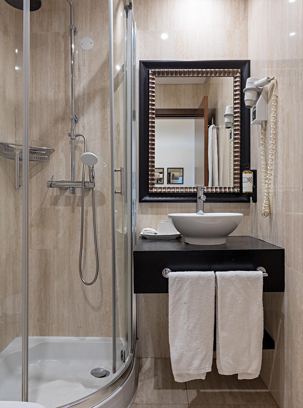 The Cliff Suite T2 at Pestana Alvor Praia has a bathroom with a shower, a sink, a hairdryer, and a mirror