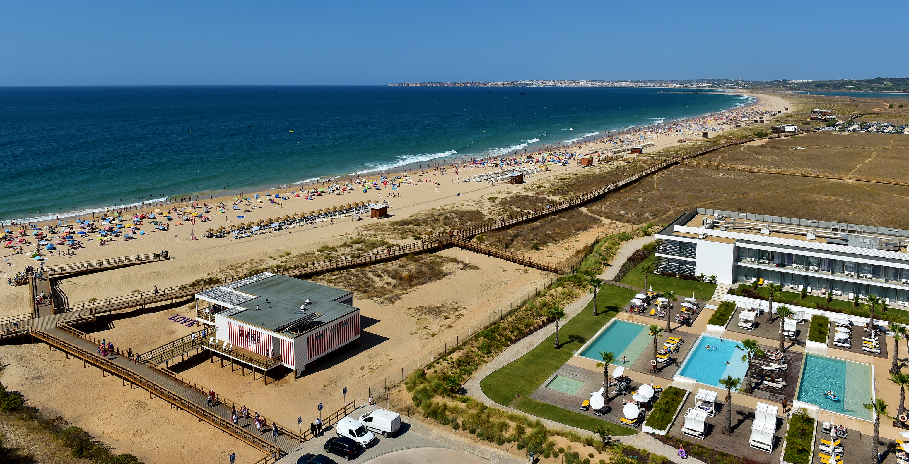 Aerial view of Pestana Alvor South Beach, Sea Deck beach restaurant, boardwalk to beach