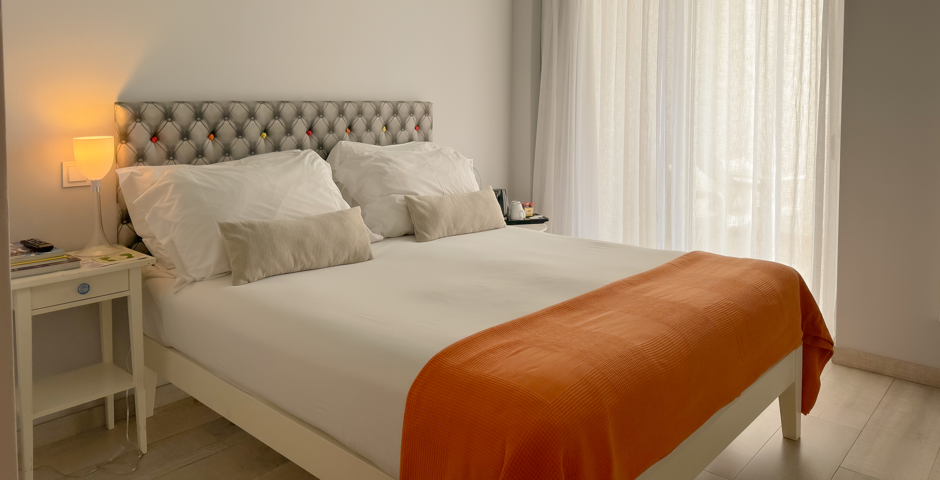 The Deluxe - Exclusive Website of Pestana Alvor South Beach has a double bed with a balcony or terrace with land view