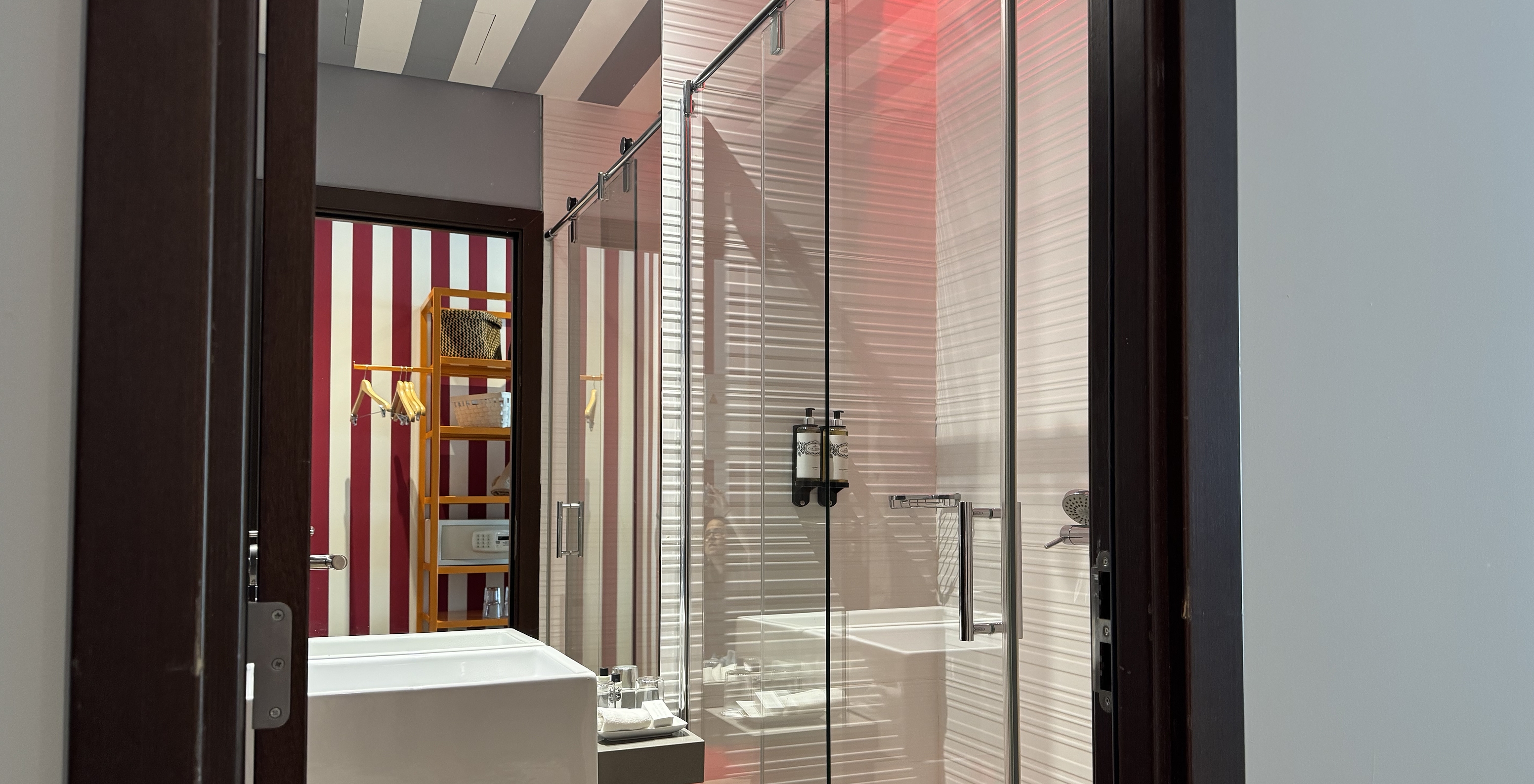 The Deluxe - Exclusive Website of Pestana Alvor South Beach has a bathroom with shower and a sink