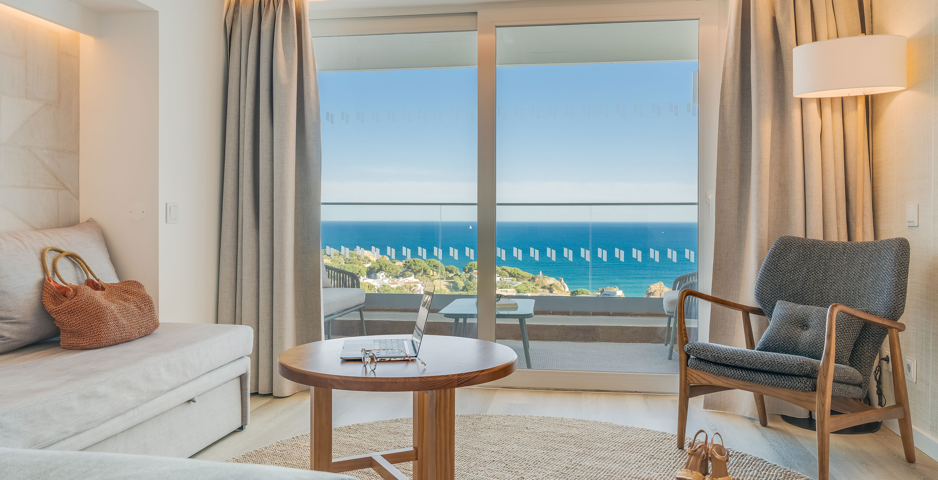 The Classic Sea View Room at Pestana Blue Alvor Beach has a balcony with a small table, two chairs, and a sea view