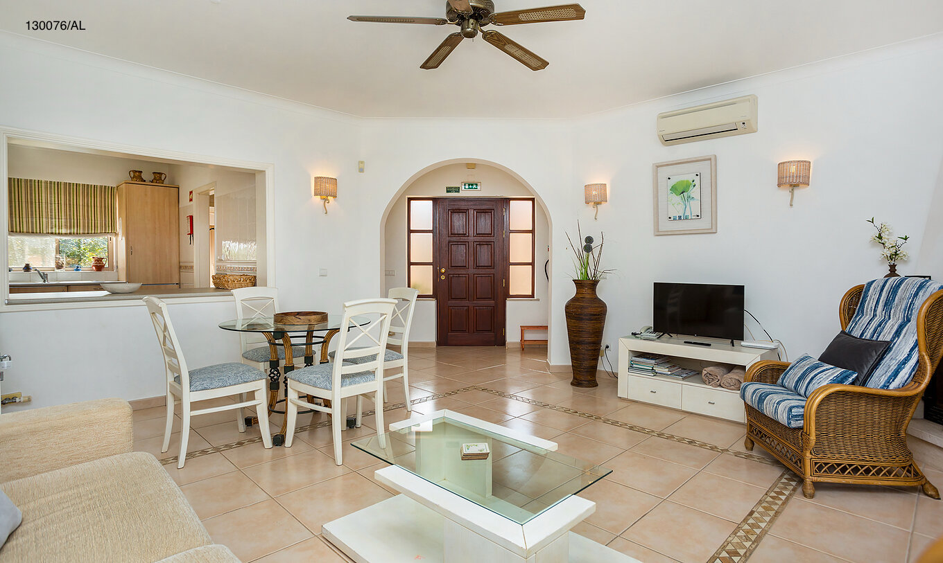 The Pestana Carvoeiro Golf T2 Standard Apartment has a living room with a view to the kitchen