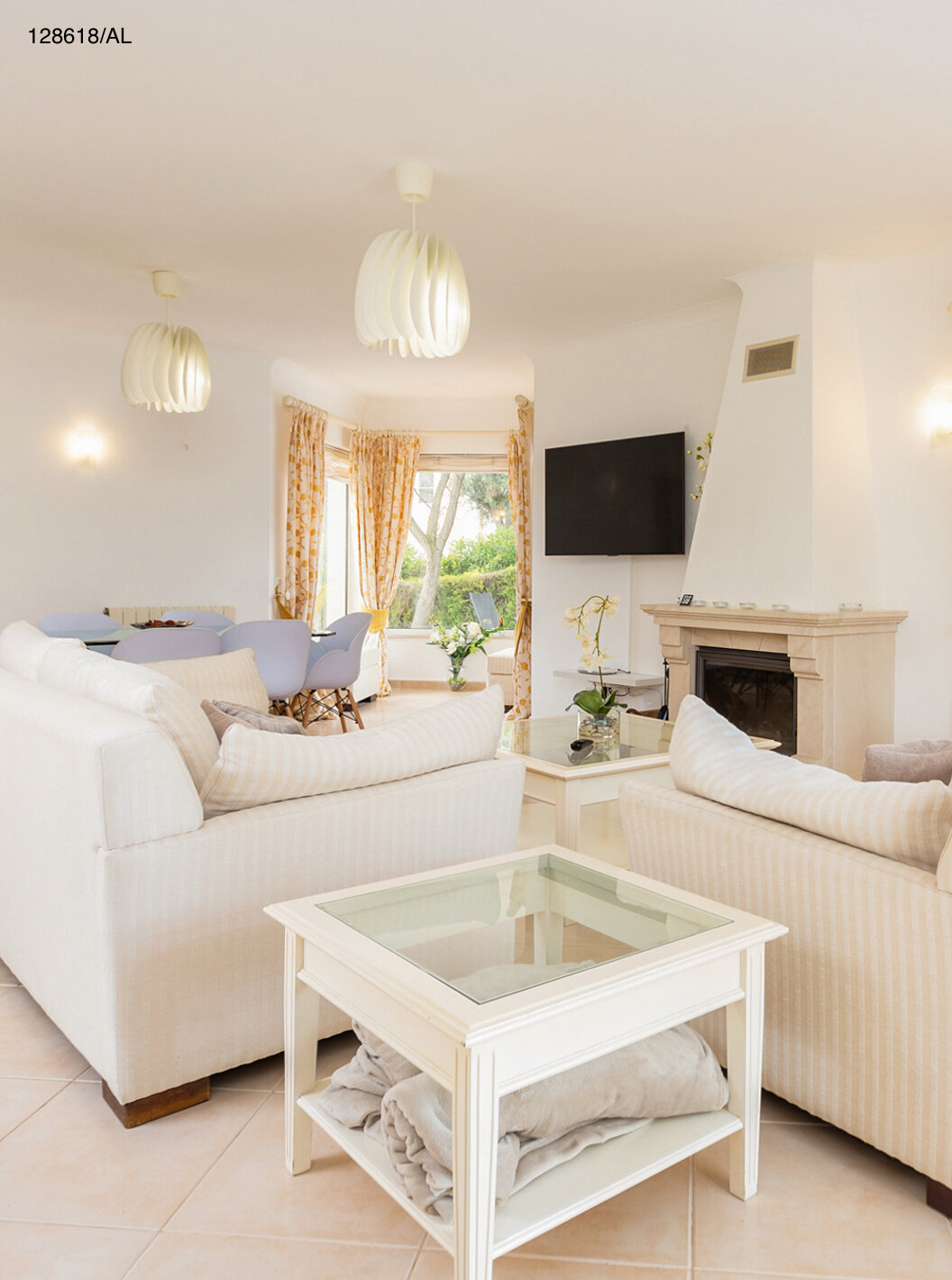 The Pestana Carvoeiro Golf V3 Superior Villa has a living room with two sofas, TV, and a view of the exterior