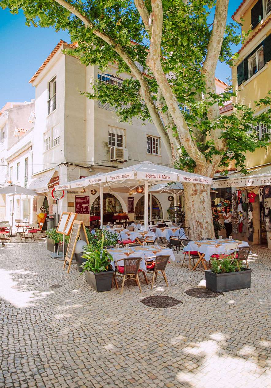 Largo Camoes near Pestana Cidadela Cascais, Hotel 5 Estrelas em Cascais, with shaded cafe terraces and cobbled square