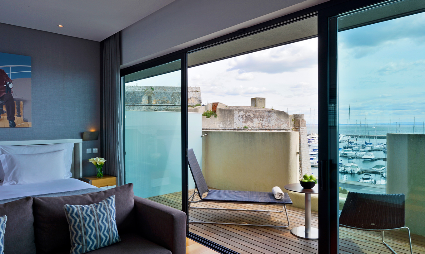 The Superior Double Room at Pestana Cidadela Cascais has a balcony with a deck and a sun lounger, with a sea view