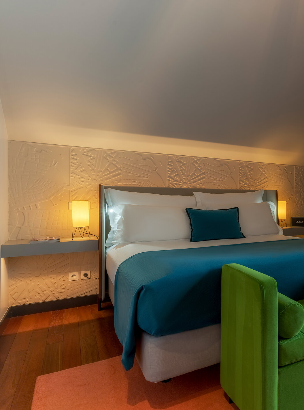 The CR7 Suite has a double bed a bench at the foot of the bed and a balcony at Pestana CR7 Lisboa