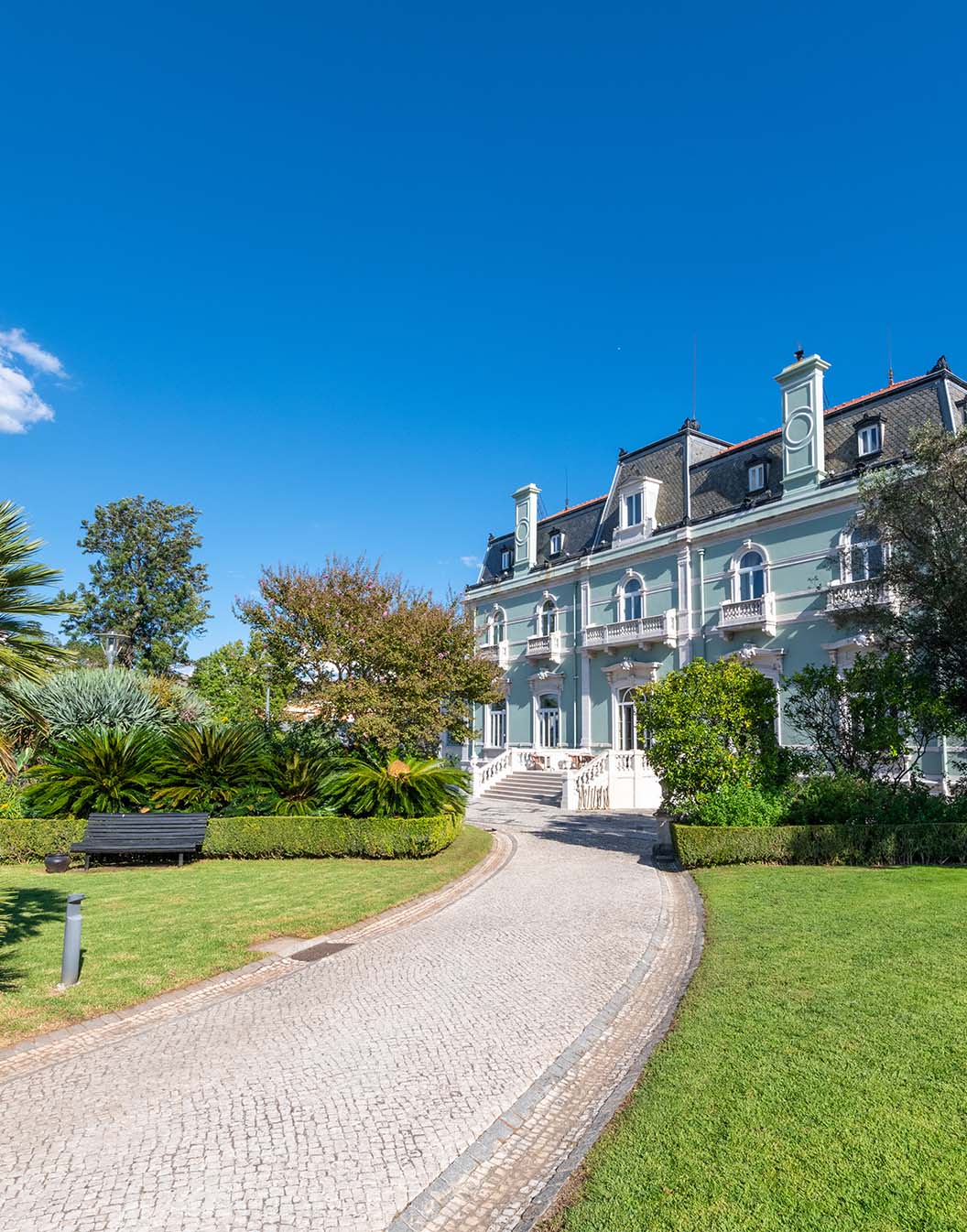 View of the Pestana Palace Lisboa building, a 5-star hotel, National Monument, an old palace surrounded by well-kept gardens