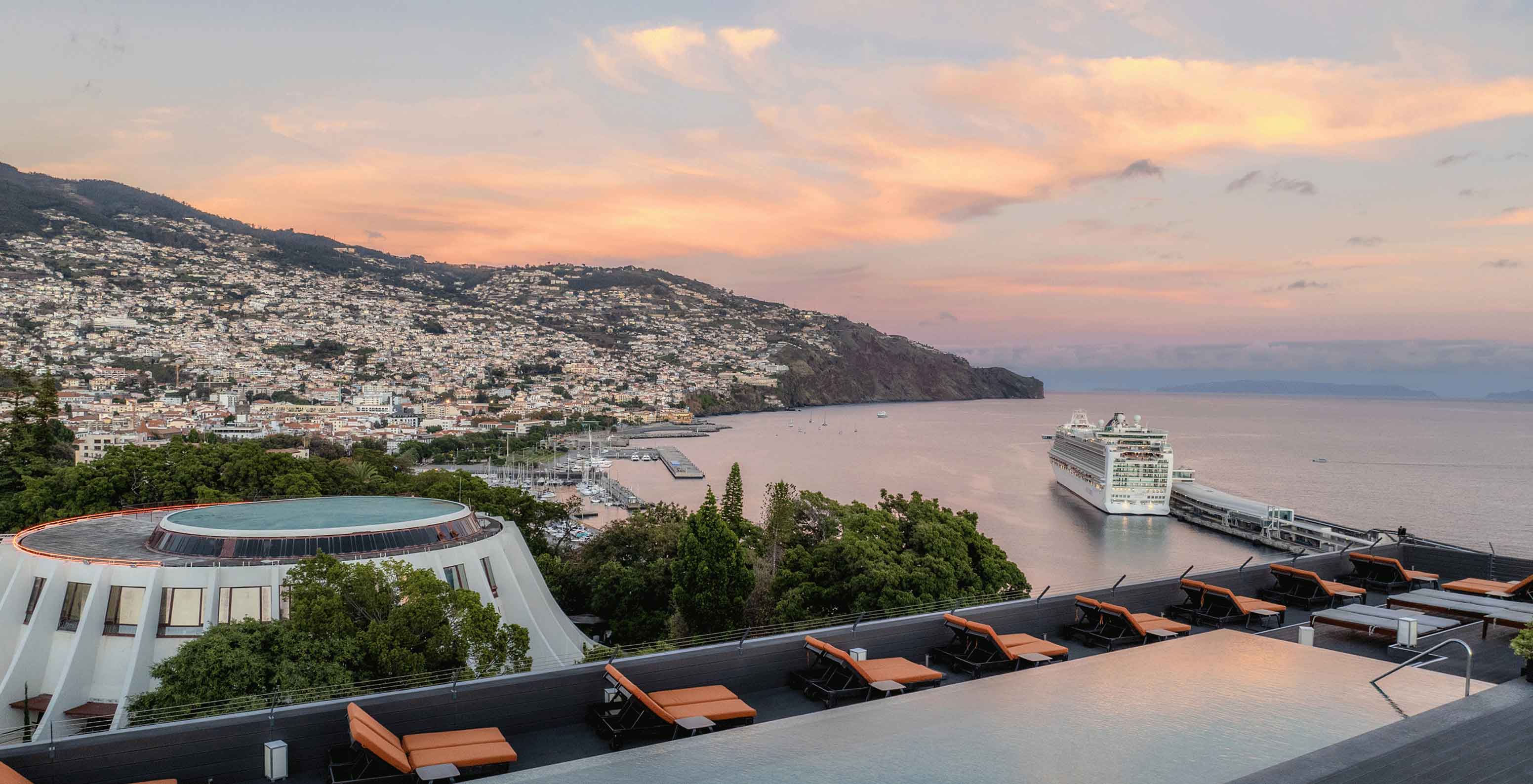 Aerial view of the pool and the view from the Pestana Casino Park, a hotel in Funchal on the seafront, with a spa and swimming pool.
