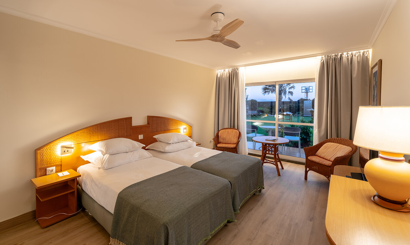 The Pestana Ocean Bay All Inclusive Classic Pool View has two single beds joined together with a garden view